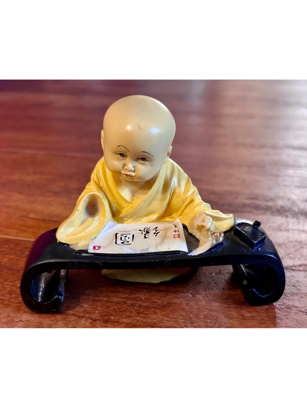 Vintage Yellow Monk Figurine with Scroll and Black Stand